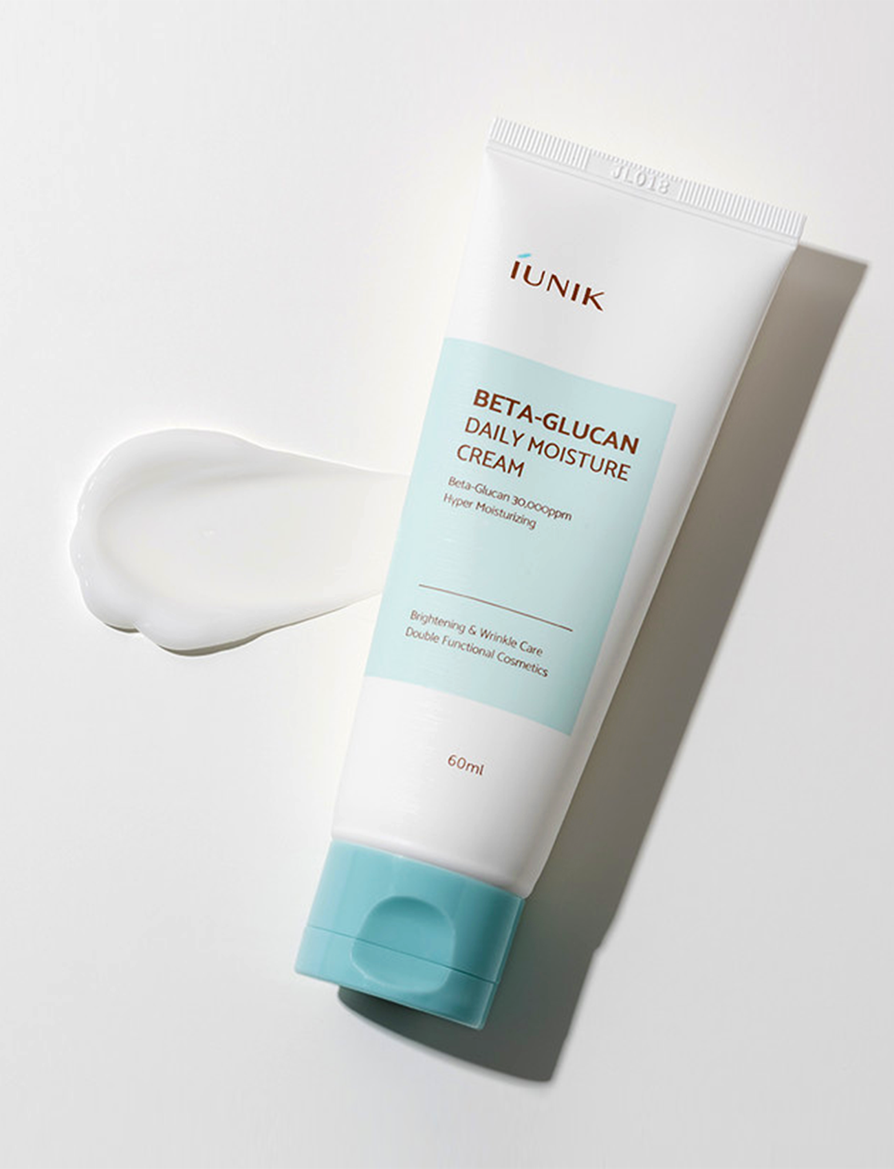 iUNIK Beta-Glucan Daily Moisture Cream mit der Textur neben dem Produkt.